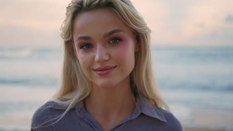 attractive lady looking seashore on amazing evening portrait. smiling girl rest