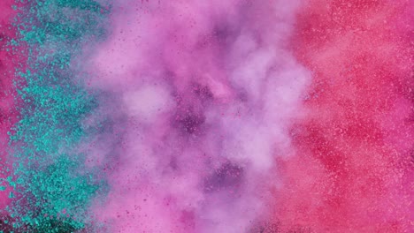 super slow motion of colored powder explosion isolated on dark background.