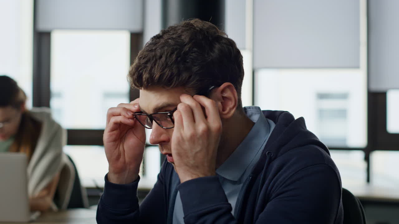 Closeup tired manager analyzing software code. Exhausted developer check project