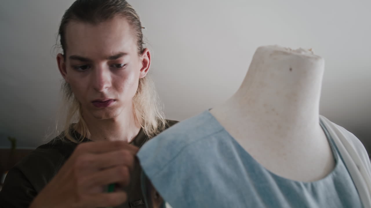 Tailor Measuring Dress on Mannequin at Atelier