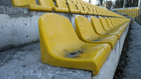 yellow chairs in an empty stadium, 4k