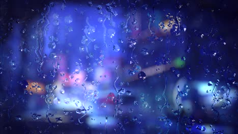 rainy night cityscape view through a window