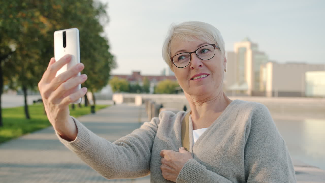 Older Woman Taking a Selfie Outdoors