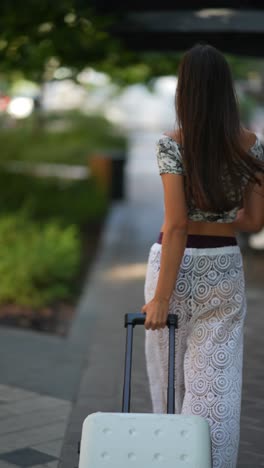 woman walking with suitcase