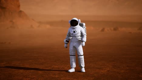 astronauta en la superficie de marte. planeta rojo cubierto de gas y roca