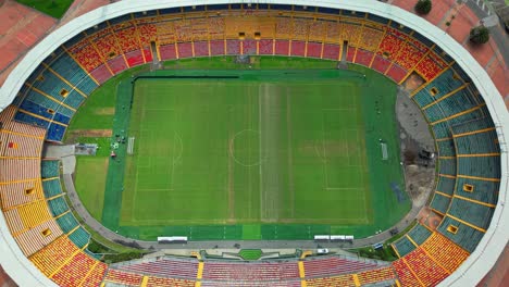 view of dolly in the empty el campin stadium and making arrangements on a sunny day in bogota, colombia.