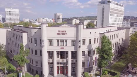 Beautiful-ascending-aerial-4k-shot-of-Law-faculty,-University-of-Belgrade,-summer-day