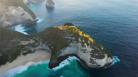 aerial view of nusa penida indonesia - the iconic kelingking t rex beach - popular tourist travel destination beautiful nature landscape near bali