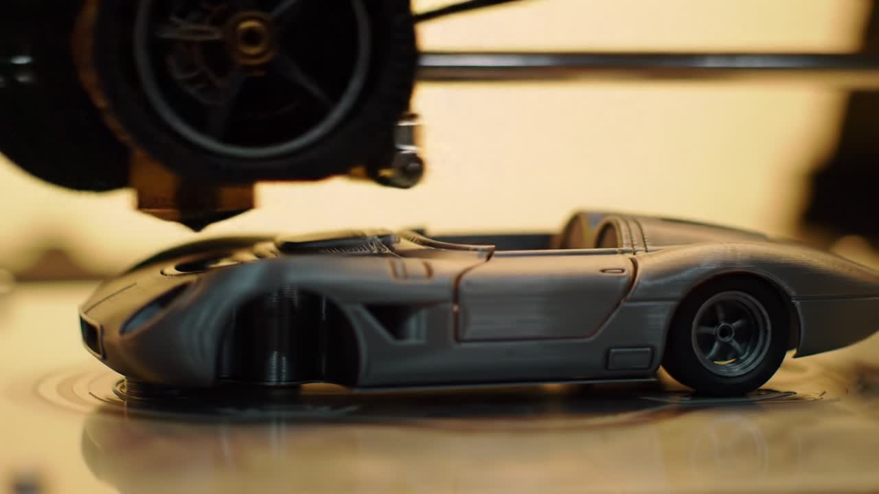 3D Printing Process Captured: Creating a Detailed Model Car with Intricate Design and Precision in Every Layer During Production