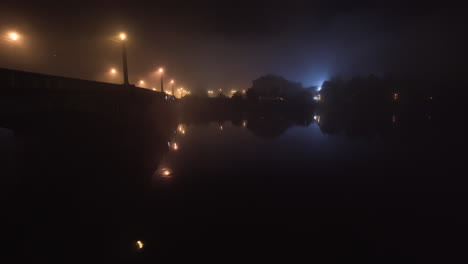 manes bridge over vltava river at night in mist,prague,czechia,streetlights