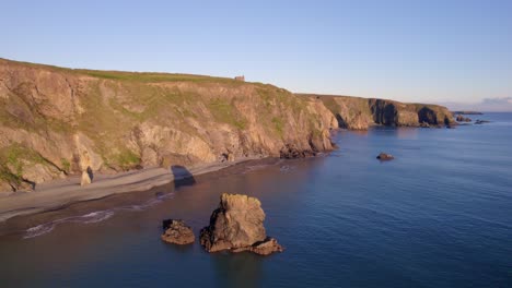 golden hour sea stacks cliffs and beach copper coast waterford ireland