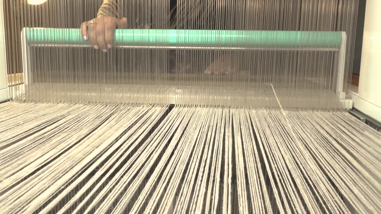 A loom with threads in action-7