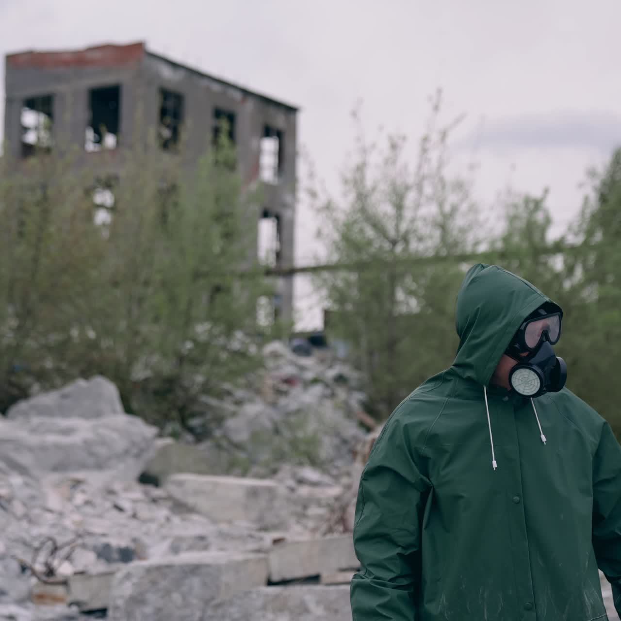 Radiation ecological disaster safety. Man in biohazard suit working in ruined city