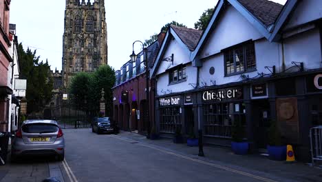 a quiet street with bars and historic architecture