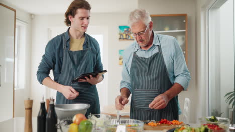 father and son cooking in the kitchen