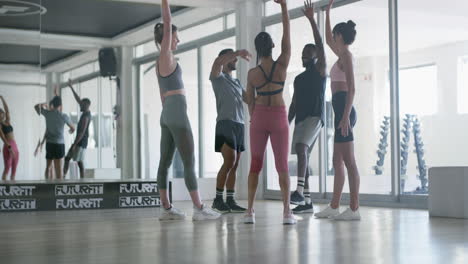diverse group engaging in an energetic fitness class
