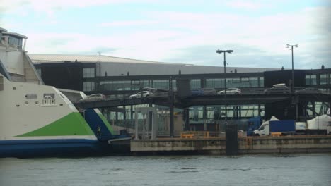 Vehicle-traffic-loaded-onto-large-commercial-ferry-in-port-of-Helsinki