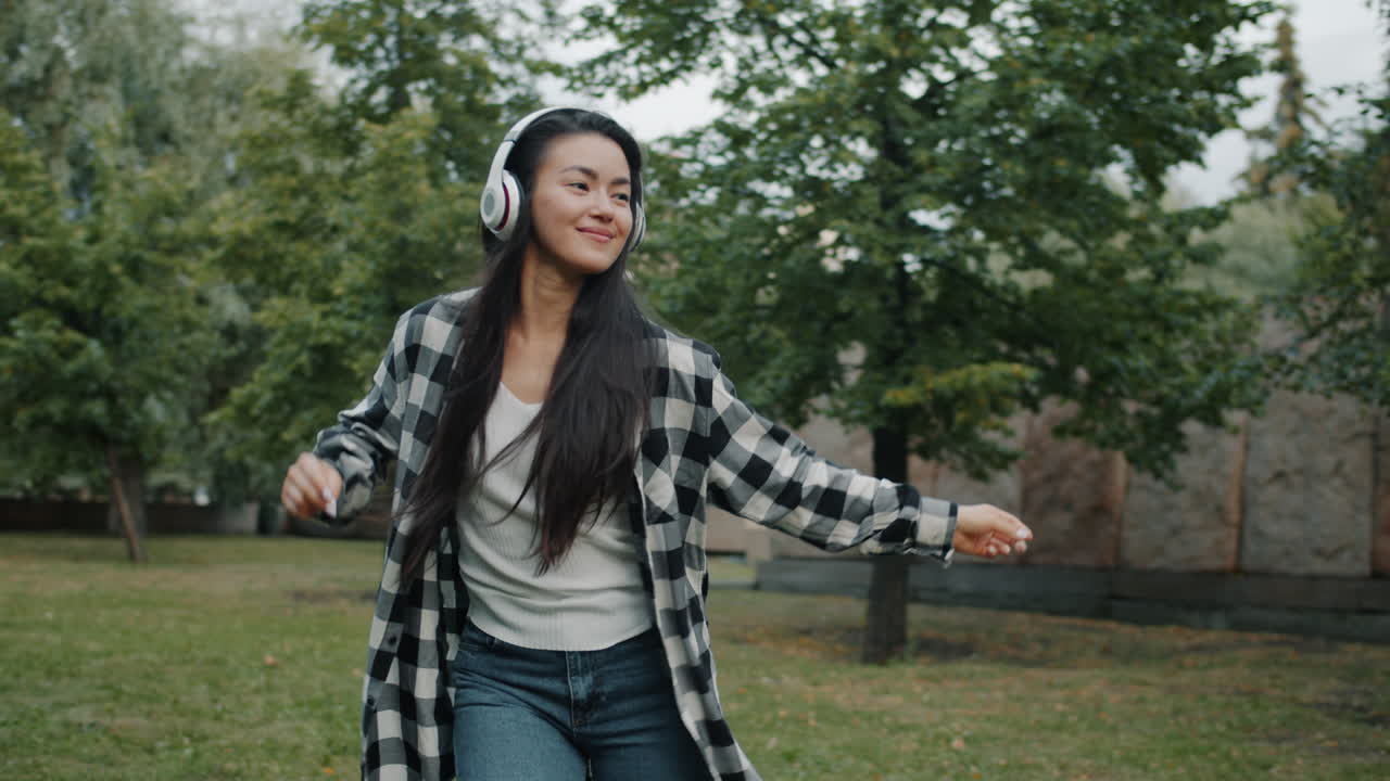 Woman Dancing in a Park
