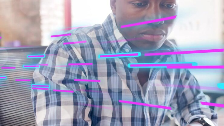 Man tapping tablet, camera pulling back, neon streaks sweeping across hands, demoing tech interface