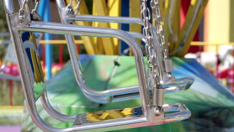 swaying metal seat of carousel