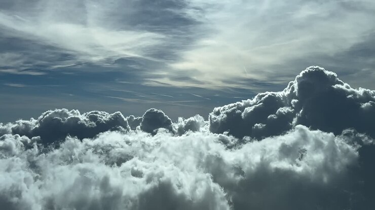 Immersive aerial pilot’s POV FPV flying through a dramatic winter sky full of storm clouds as seen by the pilots from cockpit. 4K ProRes