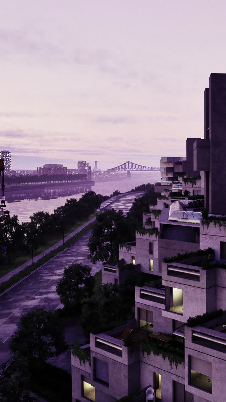 Vista de edifícios da cidade à beira do rio com ponte ao fundo ao anoitecer.
