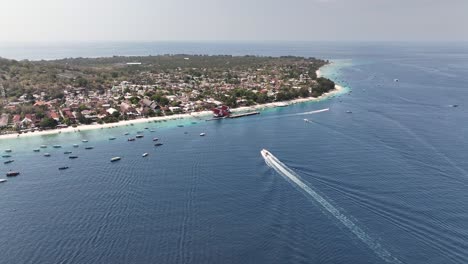boat with tourist is sailing to gili trawangan island port. favourite tourist getaway destination in indonesia.