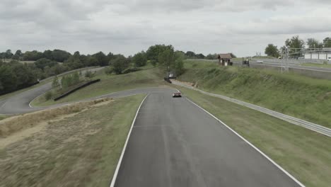 vintage car driving on pau-arnos circuit, france