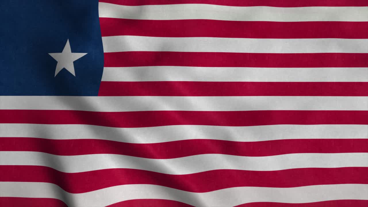 la bandera nacional de liberia está volando en el viento.