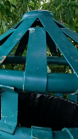 person disposes of rubbish in a bin