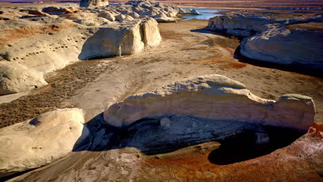 aerial drone footage sweeping toward eye-catching rock formations near lake powell in page, arizona.