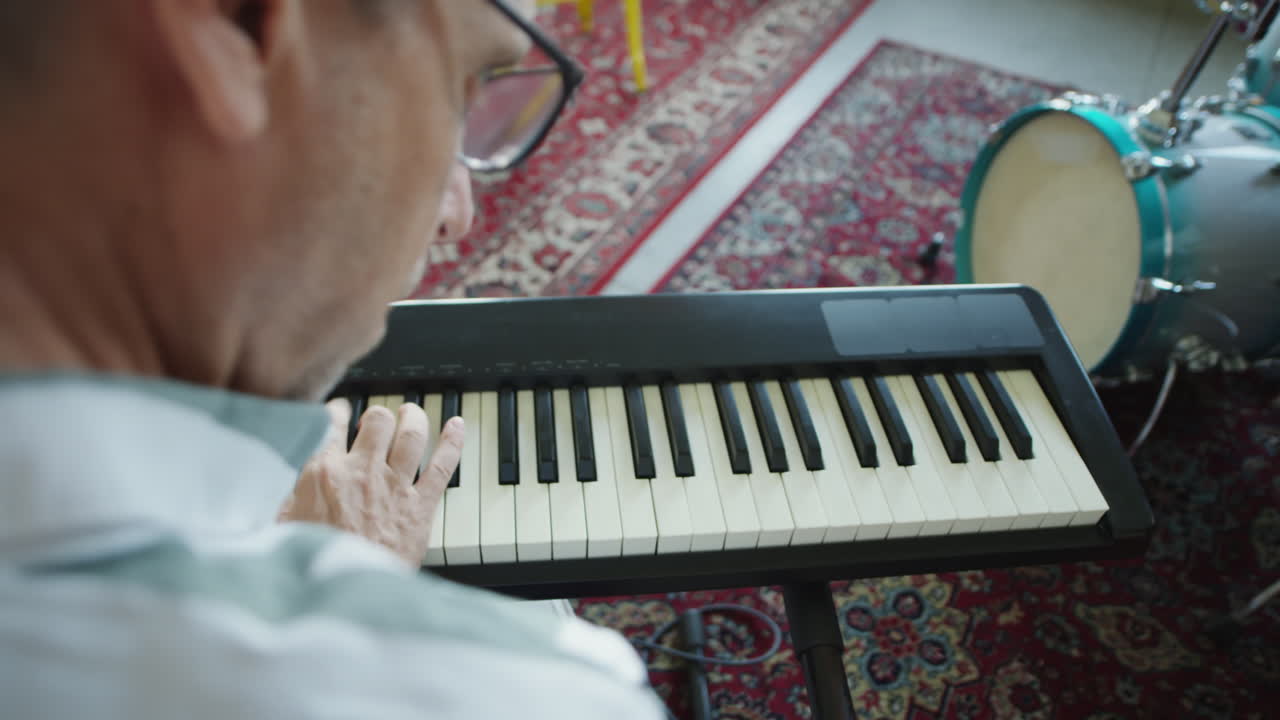 A person playing an electronic keyboard