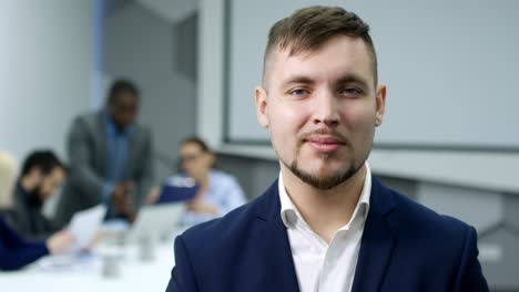 handsome businessman posing at camera