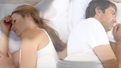 digital animation of couple ignoring each other on bed 4k