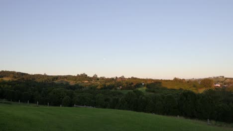 gradual transition from day to night over fields