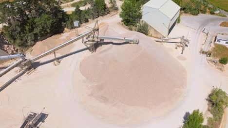 rock stone crushing machine in mining area - quarry and mining equipment - aerial shot