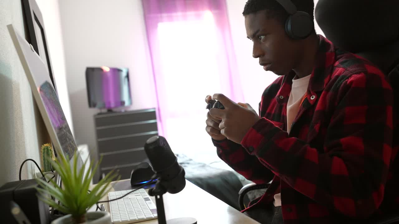 Man playing video games in his room