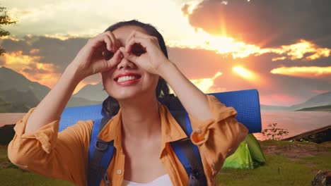 happy woman enjoying a sunset camping trip