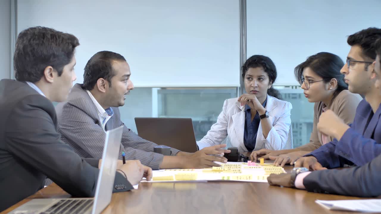 A young, diverse and dynamic mixed gender team members brainstorming on ...