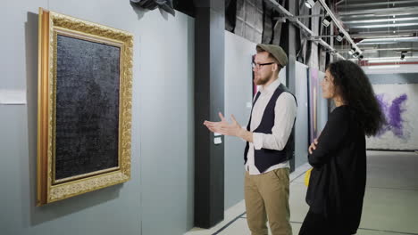 couple viewing art in an art gallery