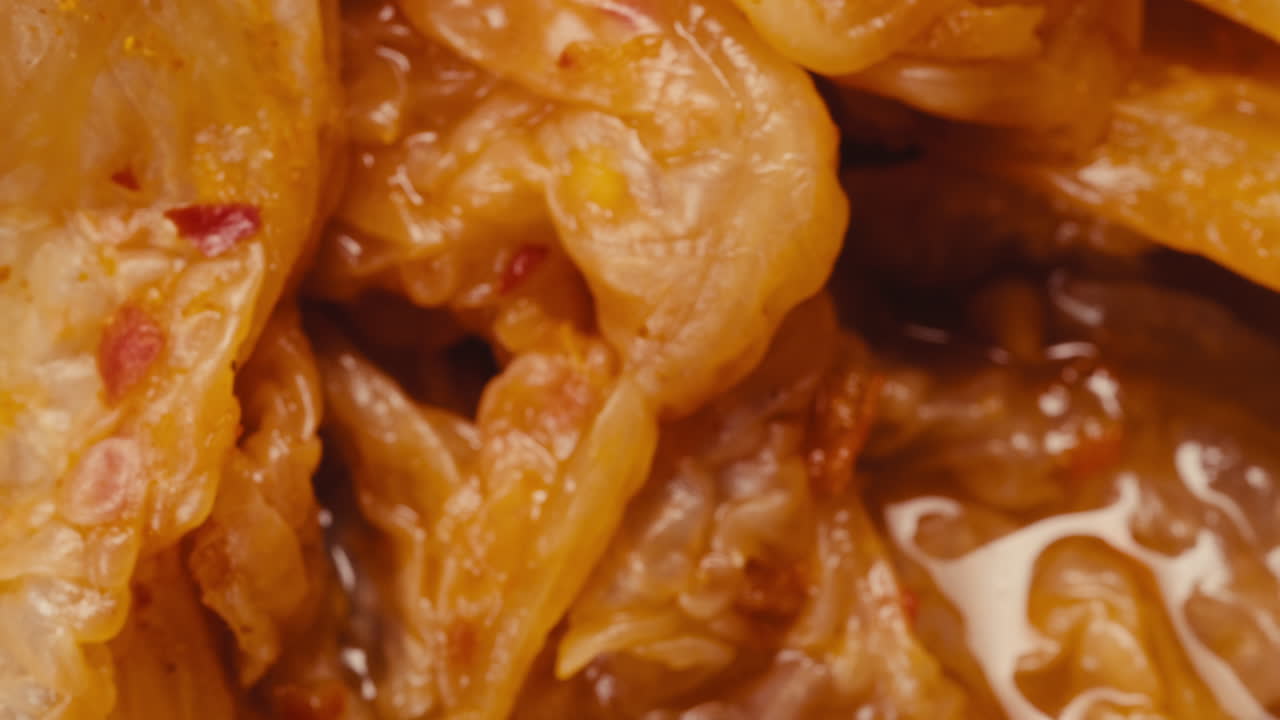 Close-up of texture fermented spicy cabbage kimchi with in can. Preservation of vegetables in glass jars. Fermentation preserved kimchi cabbage with spices macro. Asian cuisine.