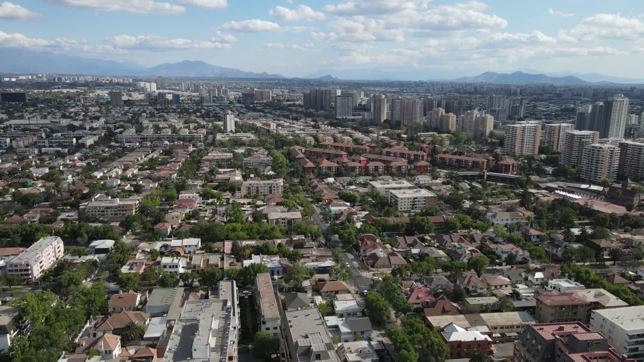 Urban development sprawls across santiago, chile, with the andes mountains providing a majestic backdrop