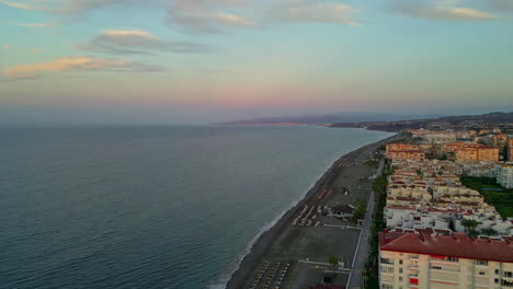 sandy beaches of small coastal town in spain, aerial view