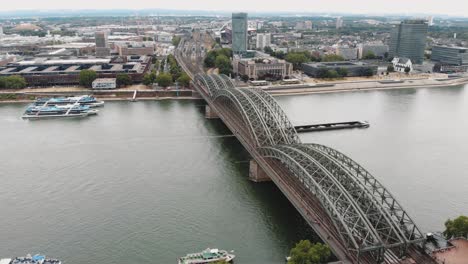 4k aerial drone footage circling the hohenzollern bridge in cologne, germany