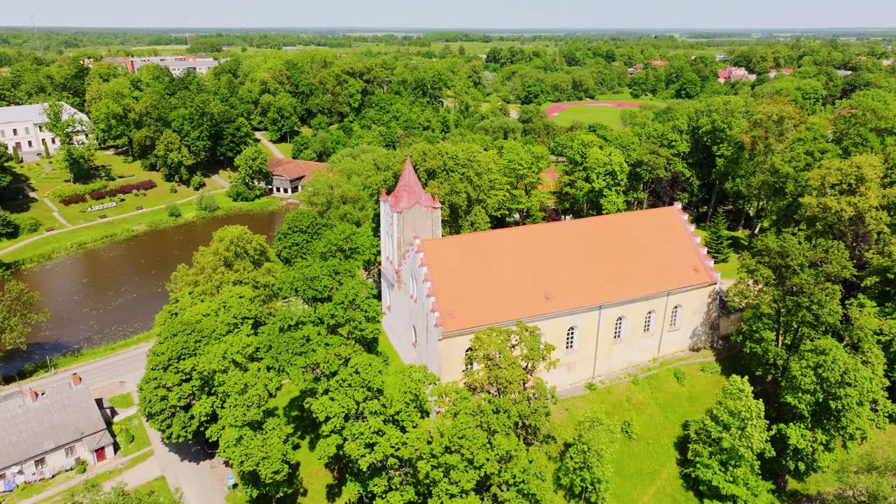 Drone of St John’s Lutheran Church architecture nestled in Latvian townscape