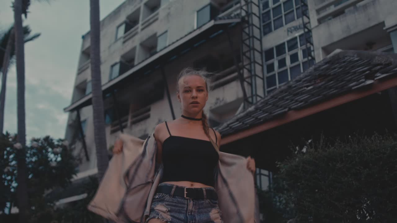 Young Woman Dancing in Urban Setting