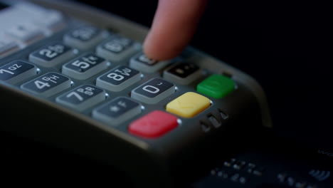 Use-credit-card.-Man-hand-with-credit-card-swipe-through-pos-terminal