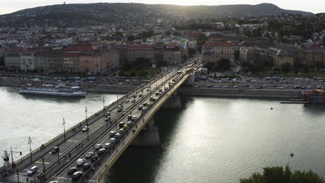 AERIAL---Beautiful-view-of-Margaret-Bridge-at-sunset,-Budapest,-Hungary,-forward