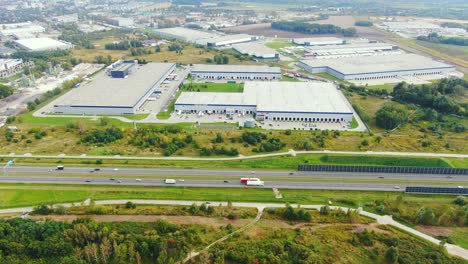 aerial view of logistics center, warehouses near the highway