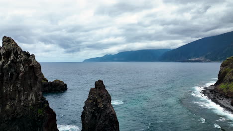 sea stack in atlantic close to shore, ilheus da ribeira da janela